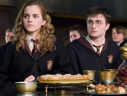 Harry and Hermione at a table.