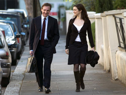 Rachel Weisz walking with Ralph Fiennes.